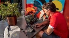 Man viewing live cycling coverage on desktop setup